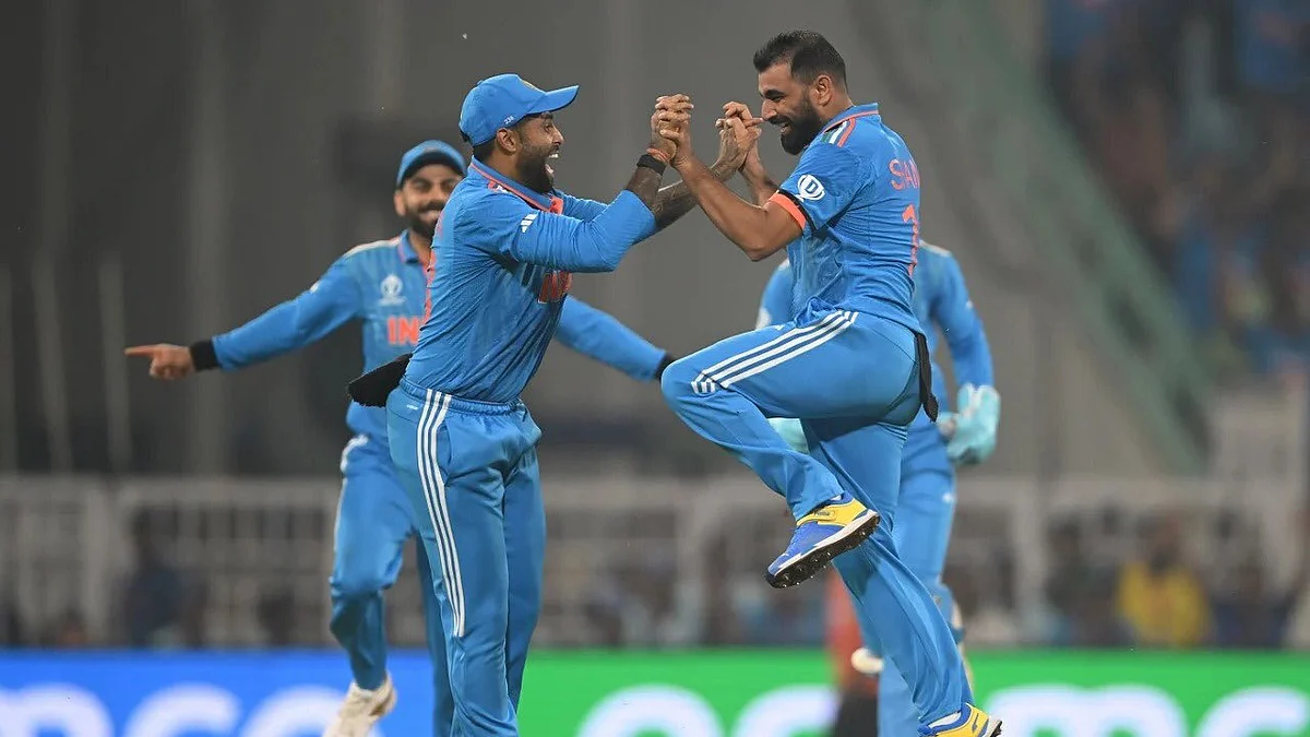 Mohammed Shami celebrates a wicket with captain Rohit Sharma (photo courtesy: @BCCI / X)