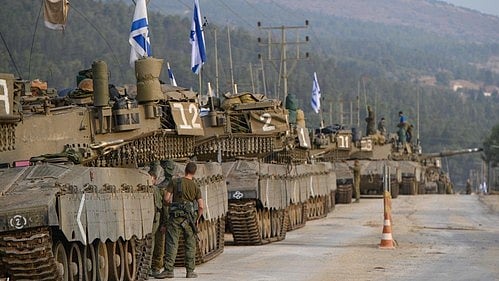 Israeli forces mass near Gaza, Netanyahu issues warning to Hezbollah