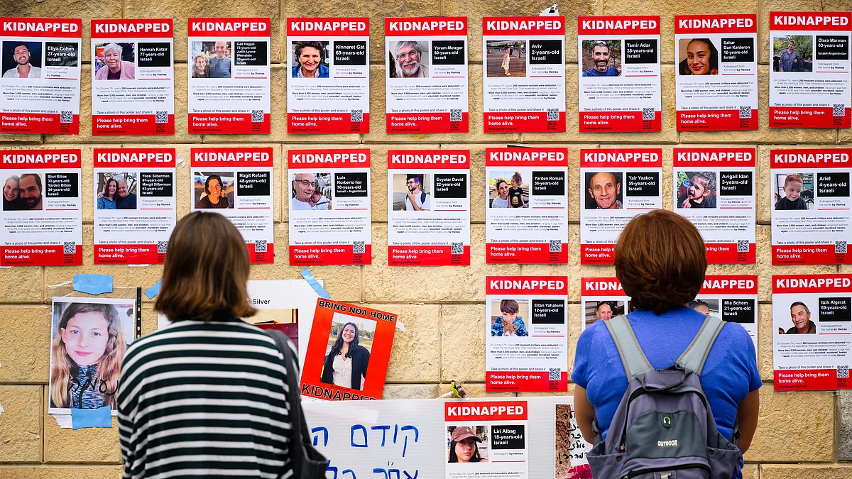 Photographs on display in Tel Aviv of some of those taken hostage by Hamas, whose families met PM Benjamin Netanyahu on Saturday (photo: Getty Images)