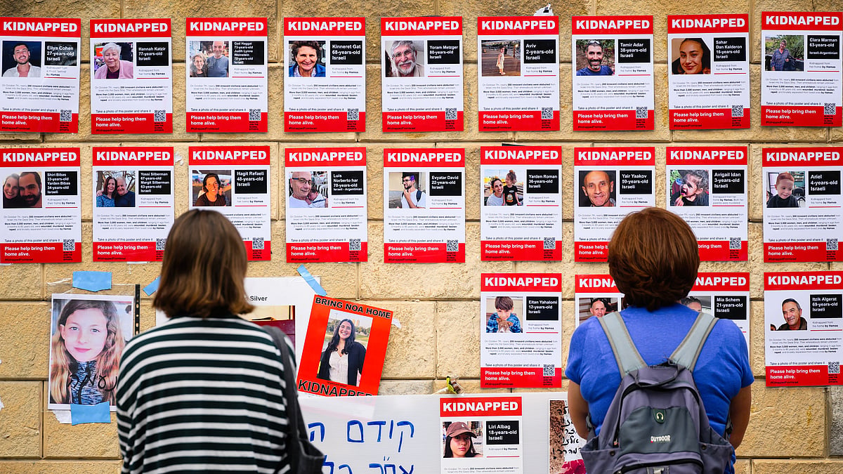 Photographs on display in Tel Aviv of some of those taken hostage by Hamas, whose families met PM Benjamin Netanyahu on Saturday (photo: Getty Images)