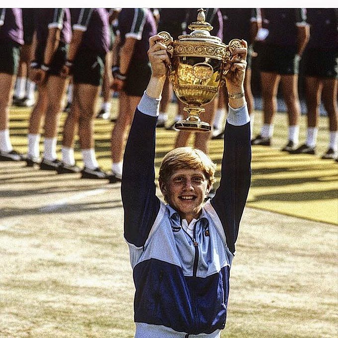 Becker poses with his first Wimbledon trophy in 1985 as a 17-year-old (Photo: @TheBorisBecker/ X)