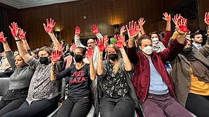 Protesters in the audience raised their red-stained hands in the air, indicating that President Joe Biden's administration had blood on its hands (Photo: IANS)