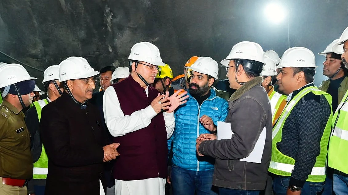 Uttarakhand CM Pushkar Singh Dhami speaks to rescue team personnel inside the tunnel (photo: @pushkardhami/X)
