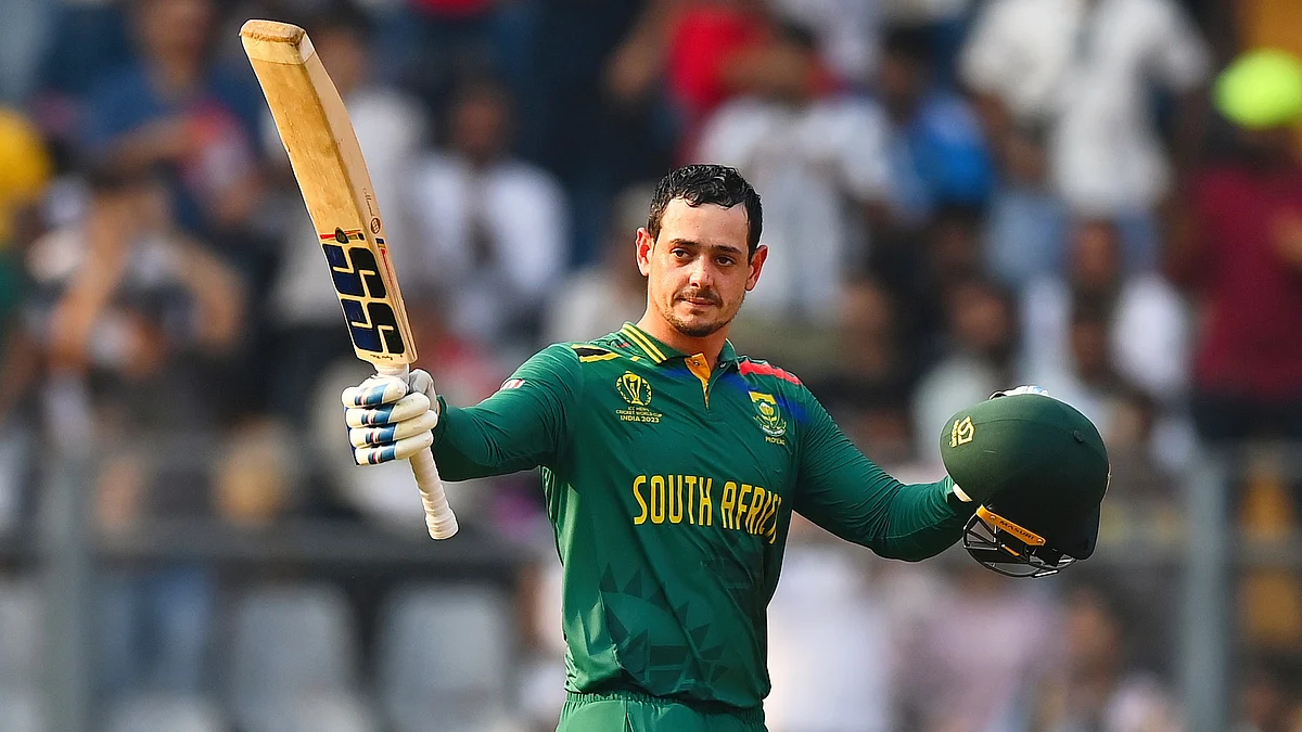 Quinton de Kock celebrates his century during the World Cup match between South Africa and Bangladesh at Wankhede Stadium on 24 October (photo: Getty Images)