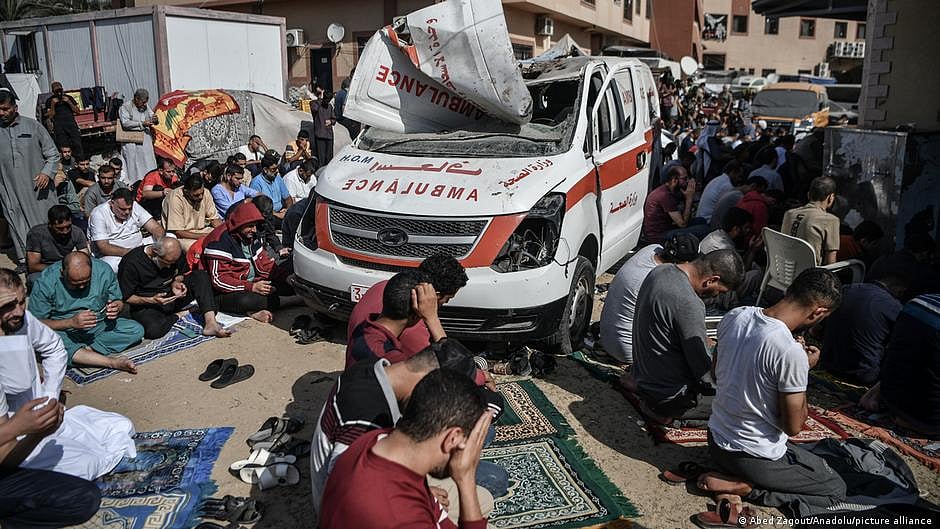 Palestinian people offering namaz near a hospital in Gaza amid continuing airstrikes by Israel 