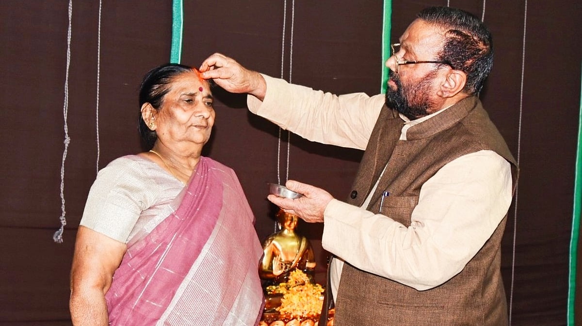 Maurya's post was accompanied by photographs showing him 'worshipping' his wife (photo: @SwamiPMaurya/ X)