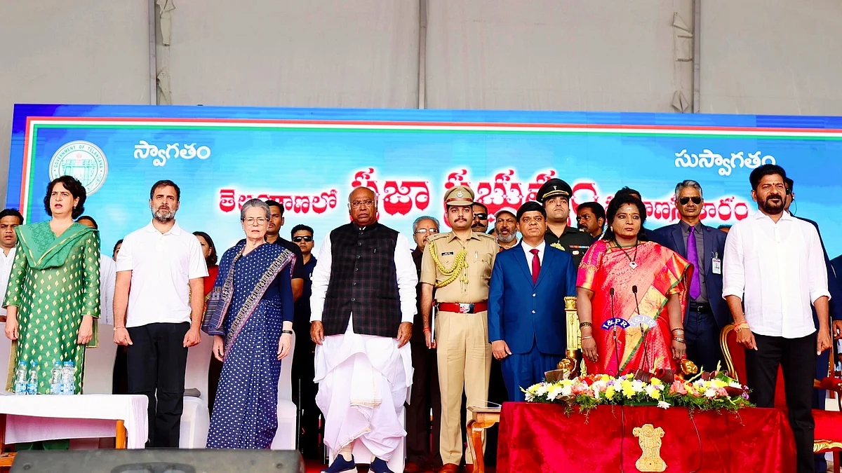 Revanth Reddy (far right) at the swearing-in ceremony along with the Telangana governor and senior Congress leaders (photo: @INCIndia/X)
