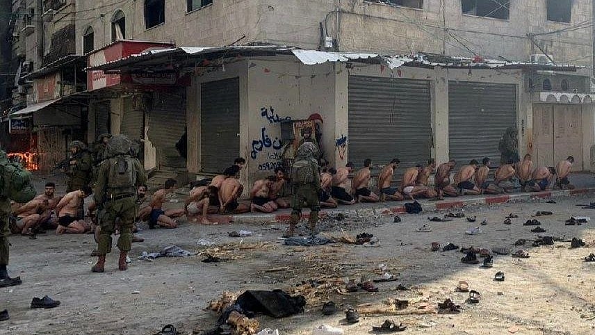 In Beit Lahia, Gaza, on 8 December 2023, a number of Palestinian males were 'arrested' from a UN school, held overnight outdoors, stripped to their underwear, by Israel Defense Forces (IDF) (photo courtesy @DALLOULALNEDER/Twitter)