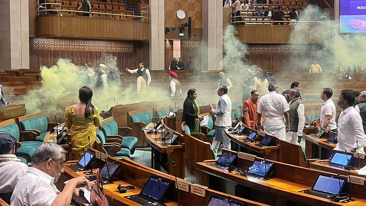 Two intruders unleashed foul smelling yellow coloured gas from canisters inside Parliament gallery on 13 December (photo: @nitinagarwalINC/X)