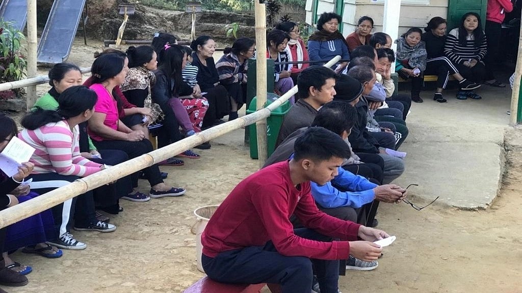 People waiting to cast their vote for Mizoram assembly elections in Aizawl, Mizoram on 7 November. There was a higher voter turnout among women compared to men. (photo: IANS)