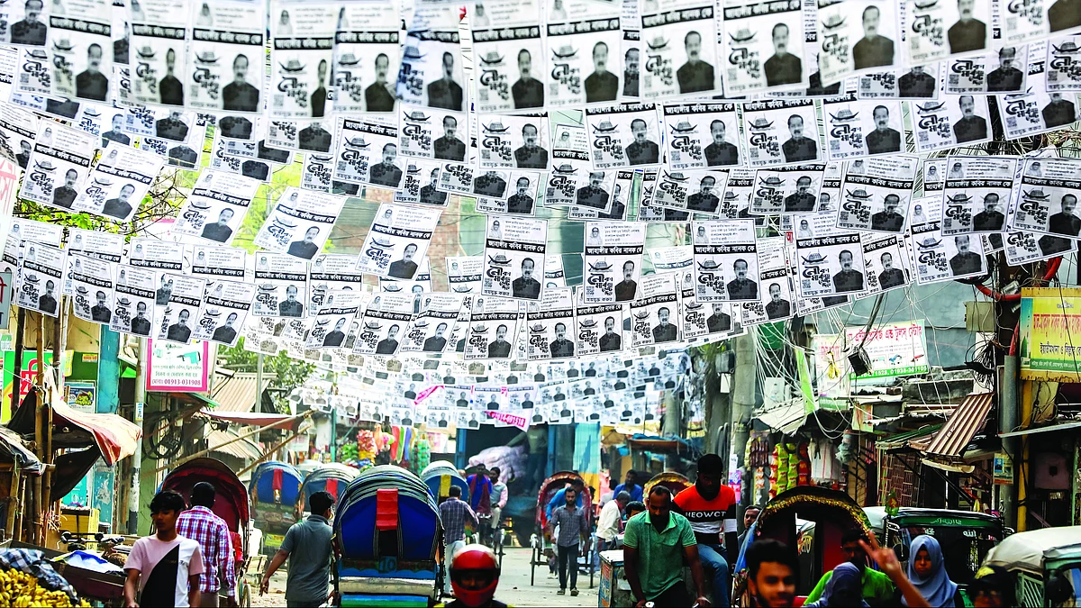 Posters festoon a street in Dhaka ahead of the general election. (Photo: Getty Images)