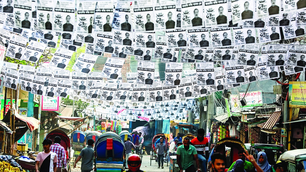 Posters festoon a street in Dhaka ahead of the general election. (Photo: Getty Images)