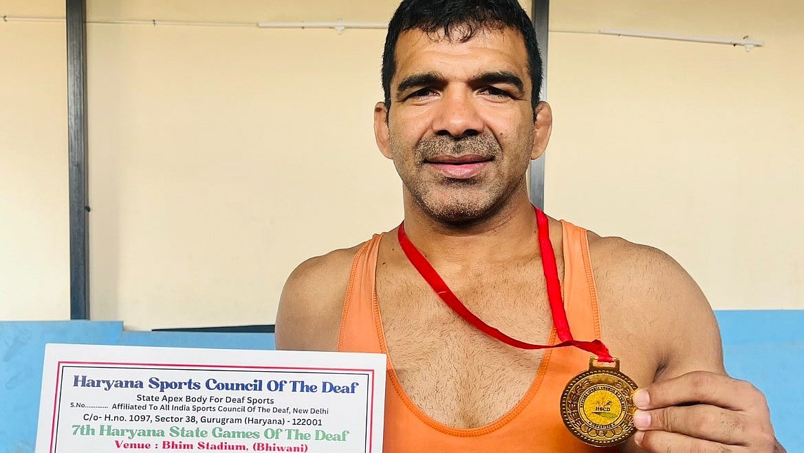 Former Deaflympics gold medallist wrestler Virendra Singh Yadav, the self-styled Goonga Pahalwan ('mute strongman') shows off a recent medal earlier in 2023 (photo courtesy @GoongaPahalwan/X)