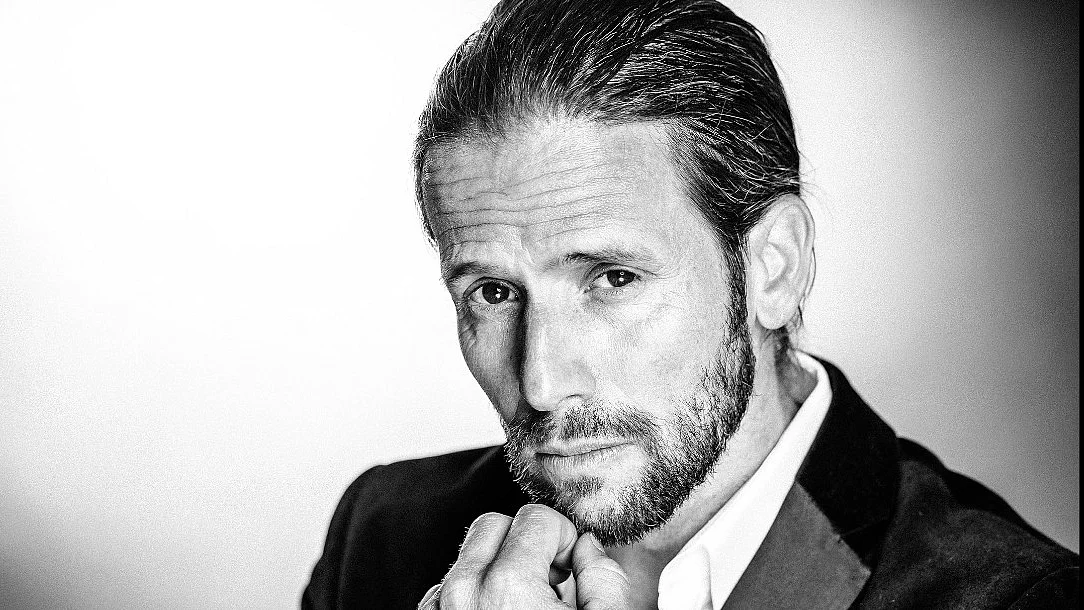 Christian Oliver (pictured) most recently appeared in last year’s ‘Indiana Jones and the Dial of Destiny’ and played the racecar driver Snake Oiler in ‘Speed Racer’ (screengrab from imdb.com)