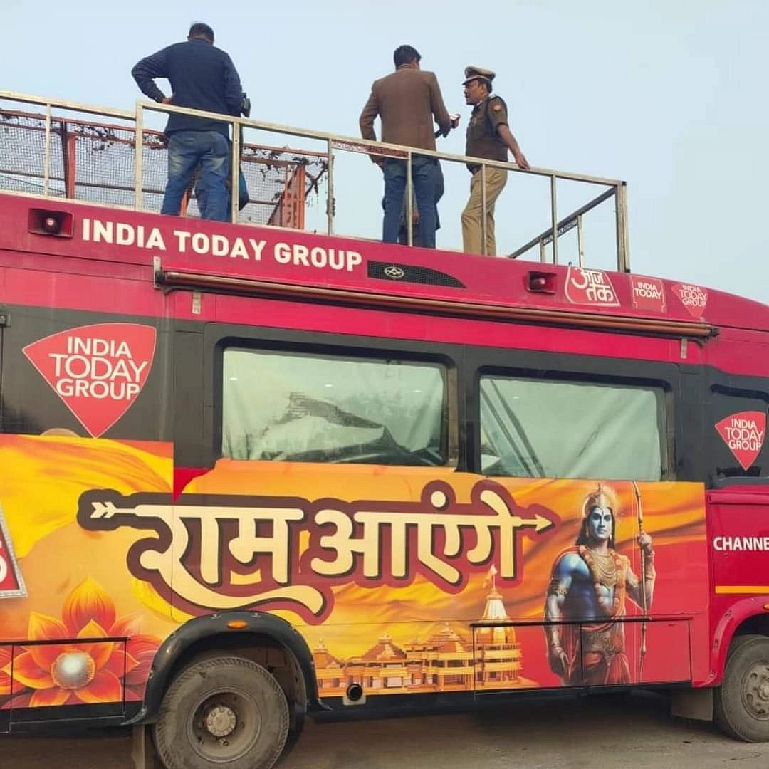An India Today media van with a saffron bhagwa banner overlaying its red brand colour, with the legend 'Ram aayenge (Ram is coming)', an image of the Vishnu avatar in adulthood leaning on his bow, and a saffron lotus blooming by its wheel