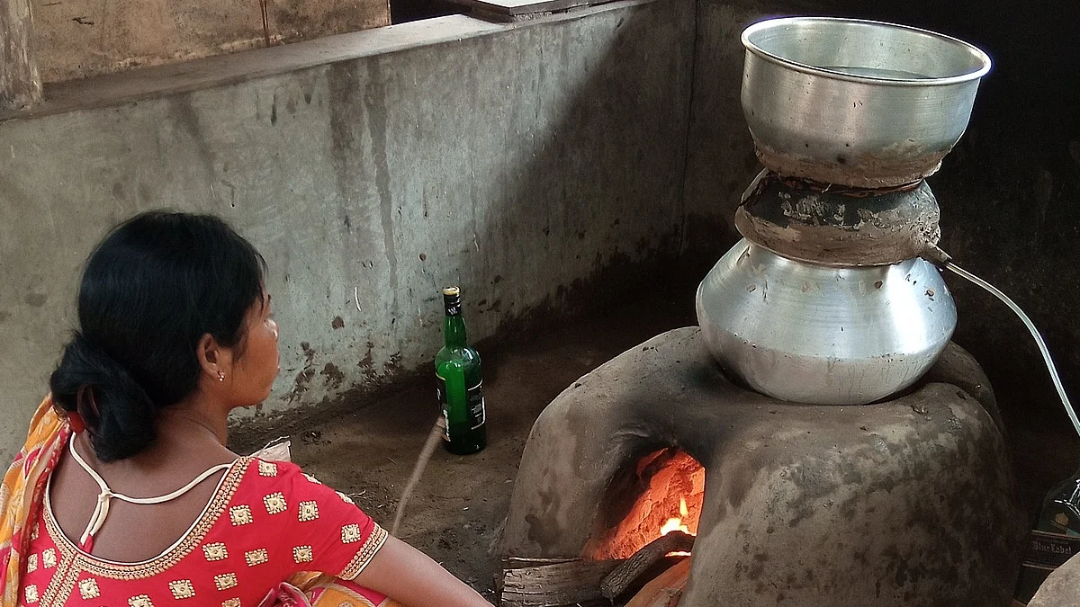 Tribal people, like this Santhal woman with her homemade still in Midnapore, Bengal, have a long tradition of making liquor—a heritage India's constitutional move towards prohibition denied, reifying a brahminical view (photo courtesy @Abhadra7/X)