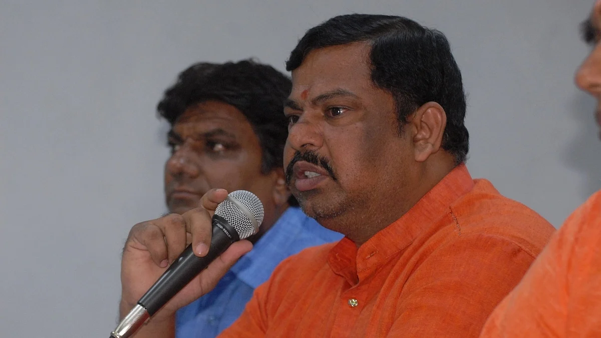 Telangana MLA T. Raja Singh (pictured, in saffron kurta) and Nitesh Rane of the BJP booked for hate speeches, leading to vandalism and stone pelting of Muslim-owned shops in the area (photo: IANS)