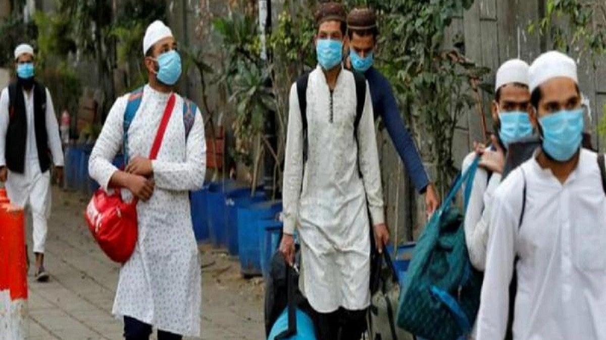 During the first Covid-19 wave, Muslim citizens found themselves pilloried, blacklisted, detained for 'corona jihad'.  Representative image shows a group of Muslim youth in surgical masks (photo: National Herald archives)