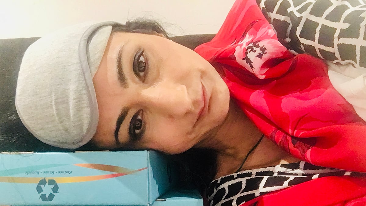 Prof Nitasha Kaul shared this photo of her stranded at the Bengaluru airport without "basic things as a pillow and blanket."