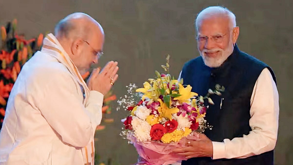 A smile that conceals? PM Narendra Modi (right) and home minister Amit Shah (photo: PTI)