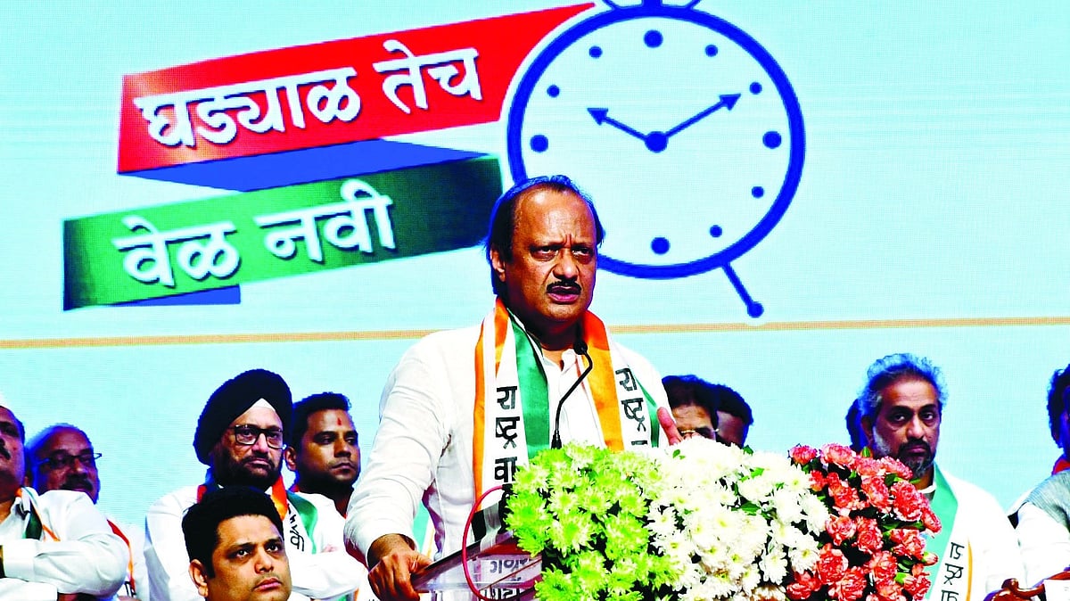 Ajit Pawar, rebel leader of the 'real' NCP, makes a speech with the clock as backdrop