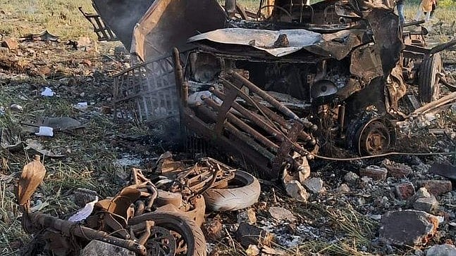 A mangled bike and other vehicles, machinery and debris near the blast site in Harda, where explosions rocked a firecracker factory (photo: IANS)