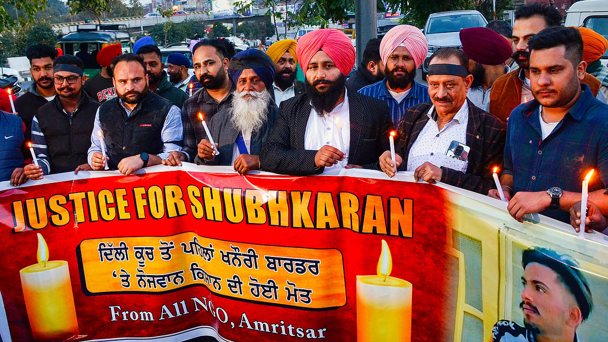 A candlelight vigil for Shubhkaran Singh — allegedly killed in police action at Khanauri — in Amritsar on  27 February (photo: PTI)
