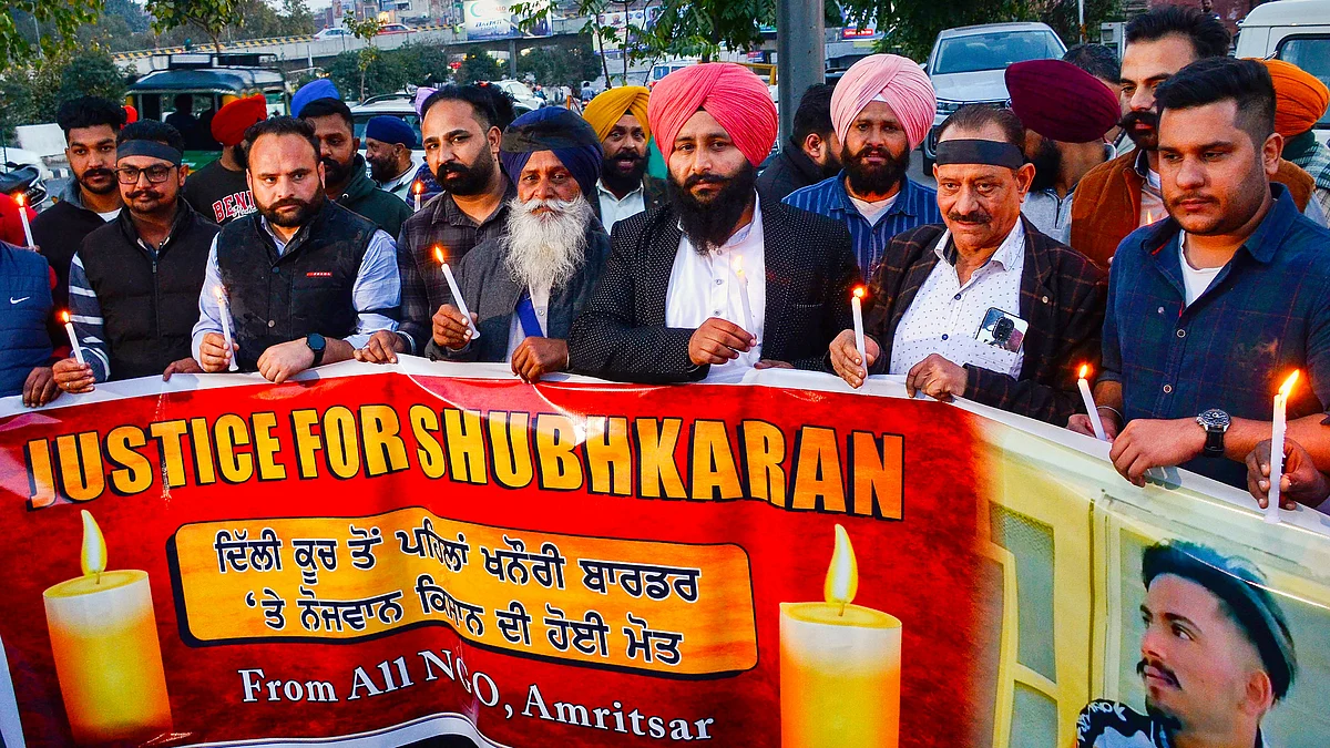 A candlelight vigil for Shubhkaran Singh — allegedly killed in police action at Khanauri — in Amritsar on 27 February (photo: PTI)