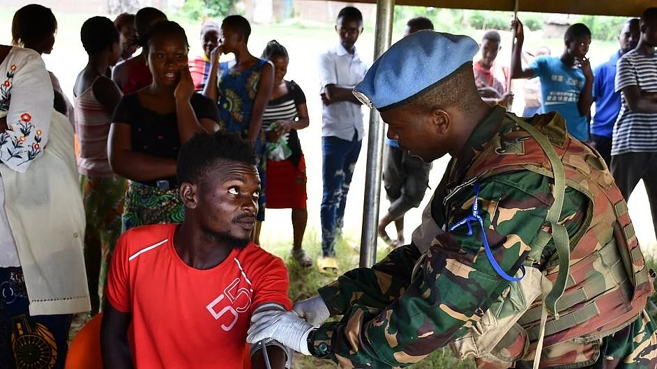 UN peacekeepers from Tanzania’s Quick Reaction Force in DRC diagnose non-communicable diseases (NCDs) for residents of Nzuma village. (photo: un.org)