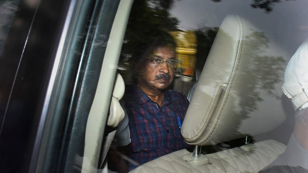 Delhi CM Arvind Kejriwal leaves Rouse Avenue court in New Delhi on 28 March (photo: PTI)