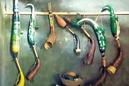 Different tarpas adorn the wall of Dhinda's house