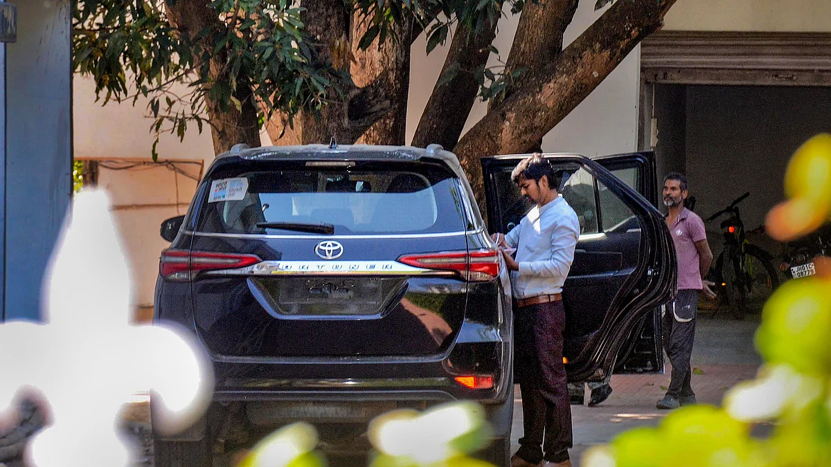 ED officials search a vehicle as they conduct a raid at the premises of Jharkhand Congress MLA Amba Prasad in connection with multiple cases, in Ranchi, 12 March (photo: PTI)