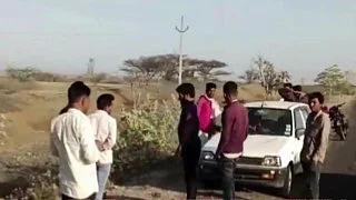 People gather at the spot where the accident took place in Jhalawar district on 24 March (photo: @PTI_News/X) 