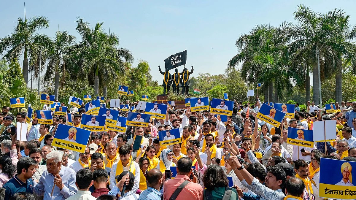 AAP workers and supporters at Shaheedi Park during a protest over the arrest of Arvind Kejriwal, in New Delhi, 23 March. (photo: PTI)