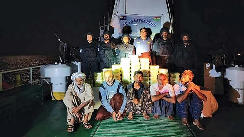 Crew of the Iranian dhow laden with drugs with their NCB and Navy captors aboard the Coast Guard ship 'Meera Behn'   