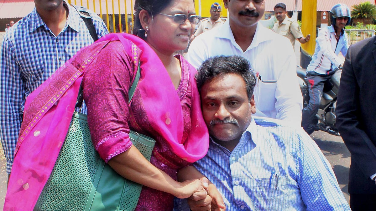 Professor G.N. Saibaba (seated) with his wife Vasantha Kumari outside Nagpur Central Jail (photo: PTI)