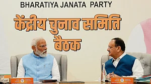 File photo of PM Narendra Modi and BJP president J.P. Nadda at a party meeting (photo: PTI)