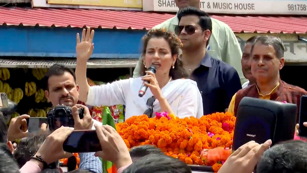 BJP candidate Kangana Ranaut addresses supporters during a roadshow in Mandi on 29 March (photo: PTI) 