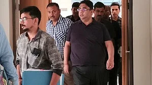 Amit Katyal at ED office in New Delhi on 11 November (photo: IANS)