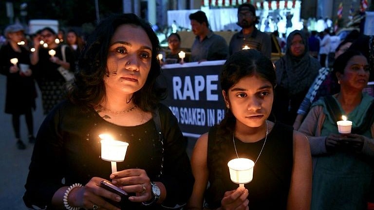 A candlelight protest vigil after the death of a raped Dalit teen in Hathras (photo courtesy @Siliconeer/X)  