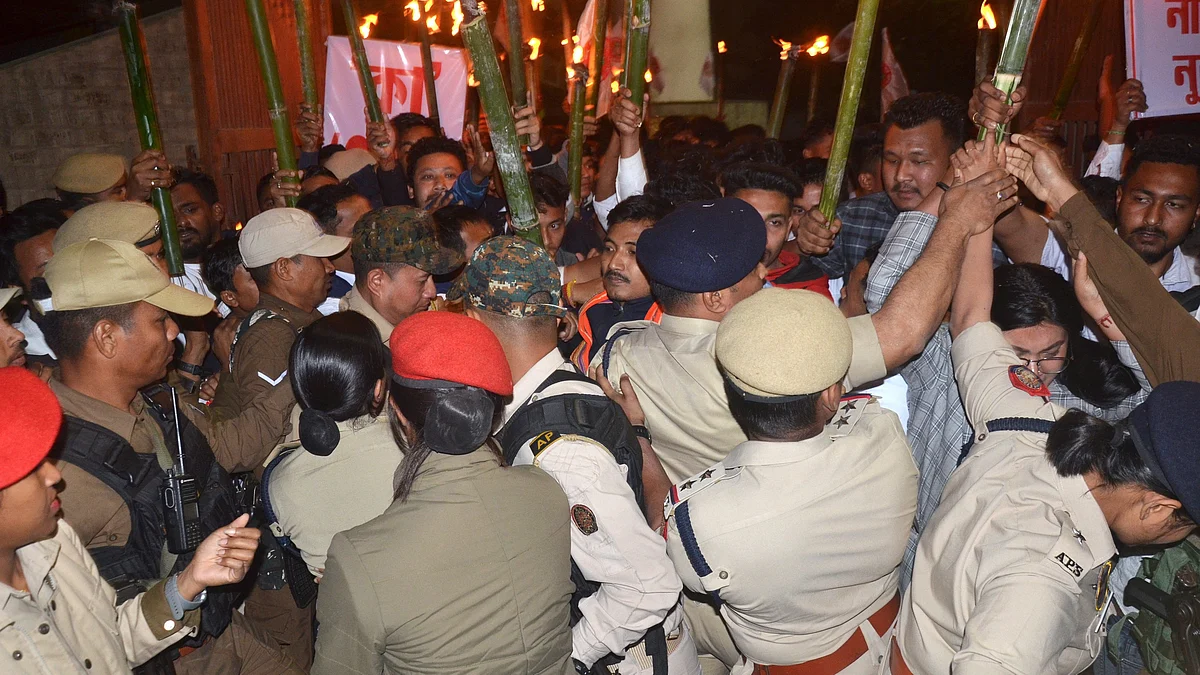 Security personnel push back the All Assam Students Union protest against notification of the CAA rules, Dibrugarh, 12 March 2024 (photo: PTI)
