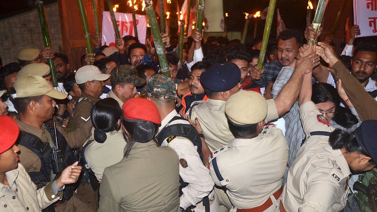 Security personnel push back the All Assam Students Union protest against notification of the CAA rules, Dibrugarh, 12 March 2024 (photo: PTI)