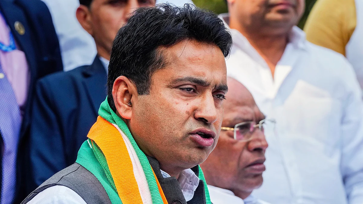 Rahul Kaswan (foreground) with Mallikarjun Kharge (photo: PTI) 