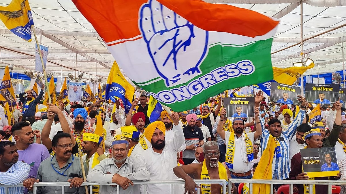 Support pours in for I.N.D.I.A. bloc, with here the tricolour Congress flag flying above the banner- and stole-bearing AAP supporters in their yellow and blue 