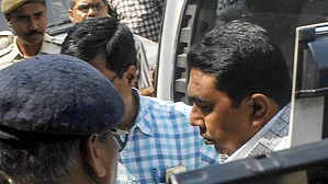 Sheikh Shahjahan being produced at West Bengal police headquarters in Kolkata on 2 February (photo: IANS)