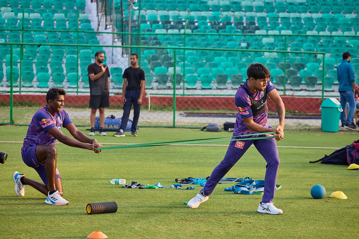 Jurel (right) does a strengthening exercise with the help of a Royals staffer (photo: Rajasthan Royals)