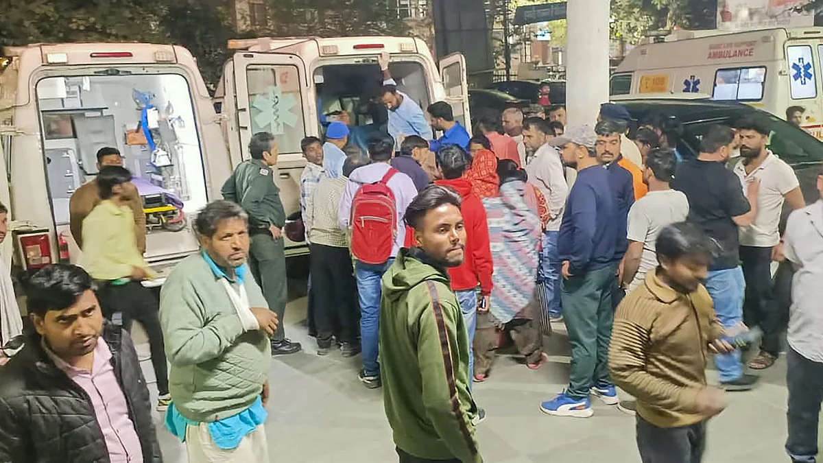 Relatives gather outside a hospital in Rewari district on 16 March. (photo: PTI)