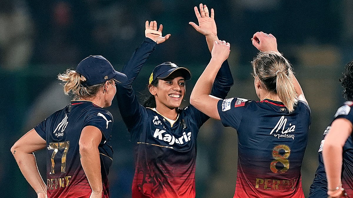 RCB bowler Ellyse Perry with captain Smriti Mandhana celebrates the wicket of Mumbai Indians batter Amanjot Kaur during the Women's Premier League (WPL) 2024 cricket match. (photo: PTI)