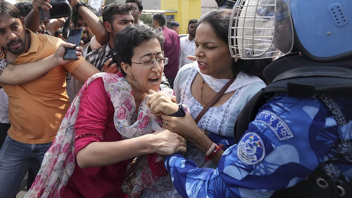 Delhi minister Atishi being detained during a protest at ITO on 22 March 