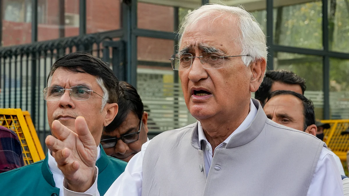 Congress leaders Salman Khurshid and Pawan Khera at Nirvachan Sadan in New Delhi on 2 April (photo: PTI)